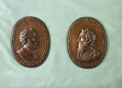 null Saint Peter and Saint Paul.
Pair of oval medals in chased bronze with a light...