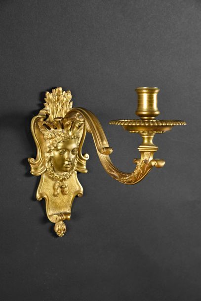 null Pair of chased and gilded bronze wall lights, the lock with Diane's head decoration...