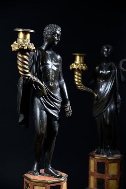 null Pair of important candelabra in patinated and gilded monks representing an antique...