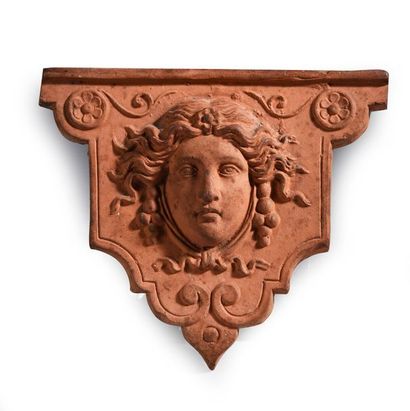 A console-shaped terracotta wall unit decorated...