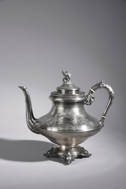 Silver teapot, baluster-shaped, on four feet...