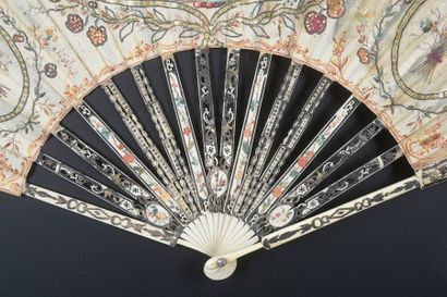 null Straw ornaments, around 1770-1780
Folded fan, the cream silk leaf painted with...