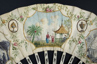 null A trip to China, around 1770-1780
Folded fan, the skin leaf, mounted in the...