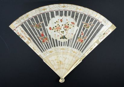 null Birds and flowers, China, early 18th century Broken ivory fan* finely pierced...