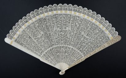 null Red fish, China, early 19th century Broken ivory fan* finely pierced with a...