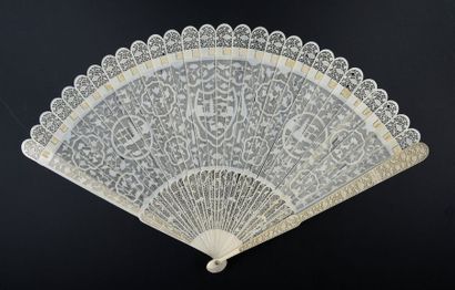  Red fish, China, early 19th century Broken ivory fan* finely pierced with a rich...