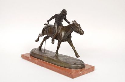 null Bronze sculpture on a red marble base. "Le joueur de Polo" by André Guiet (1880/1969)....