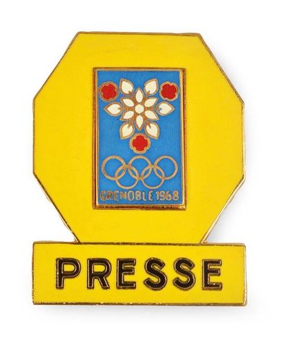 null Gold plated, yellow enamelled press badge. Dim. 35x45 mm. In its original box....