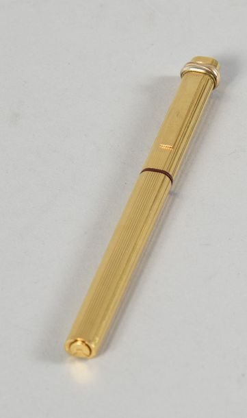null CARTIER, stylo à bille Must, plaqué or 18 ct.