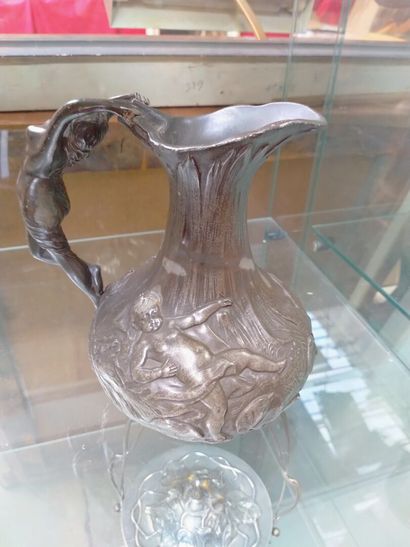 Art nouveau pewter pitcher, decorated with...
