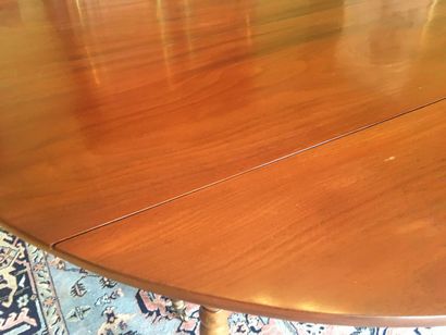 null 
A large mahogany table with six legs. Five extensions, two of which are in...