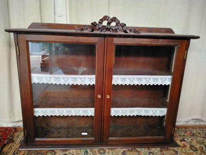 null Oak display case with two doors, decorated with a carved openwork knot. Dim...
