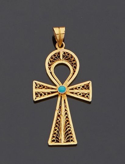 null Yellow gold cross, 14k 585%, Egyptian style, adorned with a turquoise cabochon.


H....