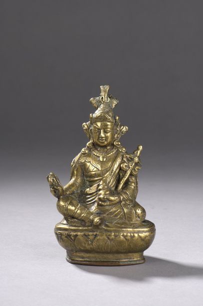 null Brass statuette showing Padmasambhava (Guru Rimpoche) sitting in lalitasana...