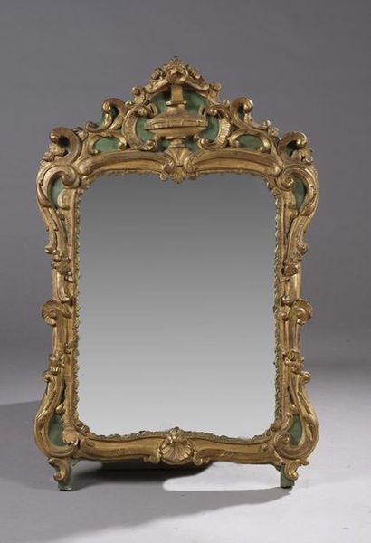 null *MIMIROIR A FRONTON in an animated frame in gilded wood and green relaqué decorated...