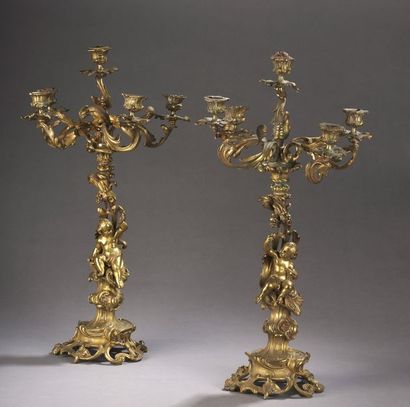 null PAIR OF CANDELABRICS rockery with five lights, it was decorated with putti....