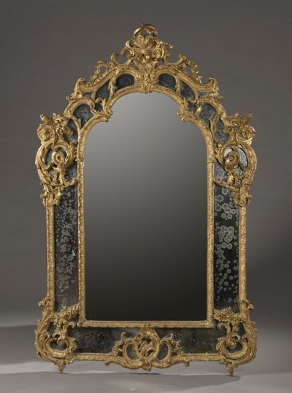 null Large mirror with gilded wooden glazing beads and richly carved with foliage...