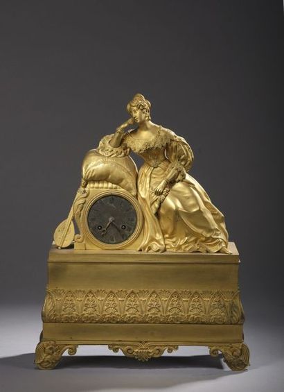 null PENDER in matt and shiny gilded bronze decorated with a romantic young woman...