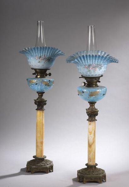 null PAIR OF OIL LAMPS with onyx column and bronze mount. Translucent blue glass...