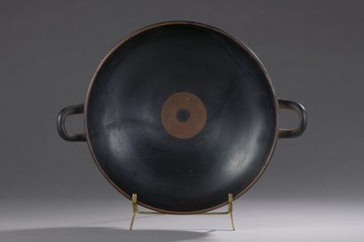 null CUT TO THE EYES.

Black-figure kylix painted on each face of a man on a fantastic...