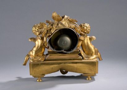null HANGING in gilt bronze with two putti around the mechanism surmounted by a hunting...