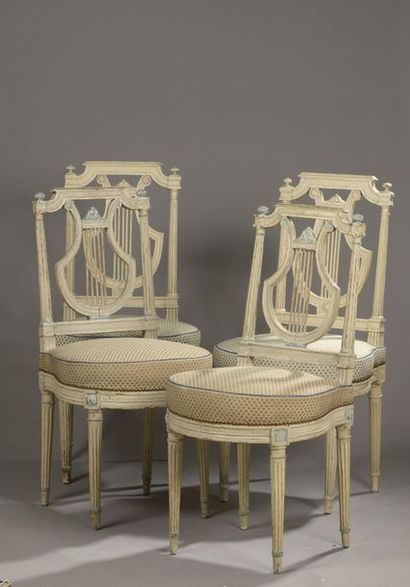 null FOLLOWING FOUR CHALLS in moulded, carved and relaquered wood with openwork backrest...