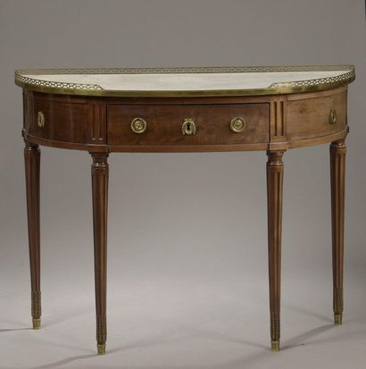 null Mahogany veneered half moon CONSOLE, opening to a drawer in belt. White marble...