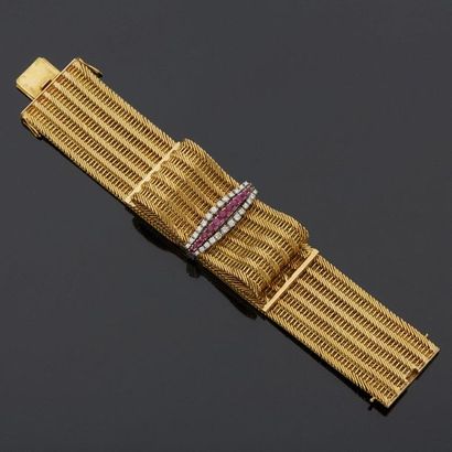 null Flexible bracelet in two-tone gold, 18k 750‰, composed of a ribbon folded in...