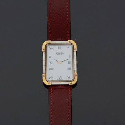 null HERMÈS PARIS 

Men's wristwatch in steel and gold-plated metal, rectangular...