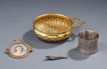 null Lot including a copper cup adorned in its center with a coin, a silver napkin...