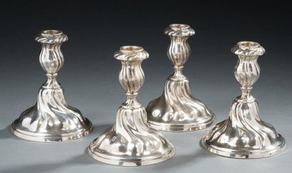 null Set of four silver table candlesticks, 2nd title 800‰, and metal with torsos...