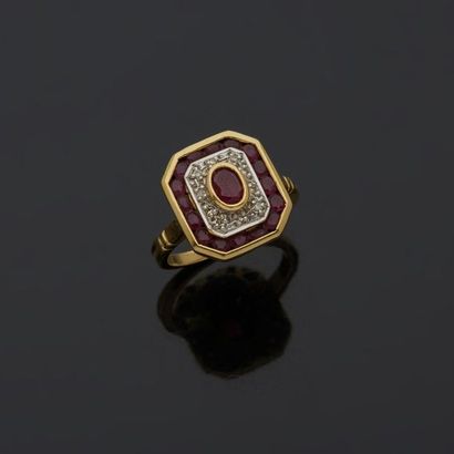 null Ring in two-tone gold, 18k 750‰, set with an oval ruby, in a double surround...