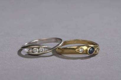 null Set including two rings: one in 18k yellow gold 750‰, fine rush set with an...