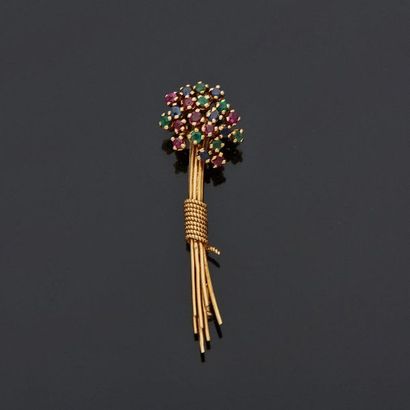  Brooch in yellow gold, 18k 750‰, in the shape of flowers, set with emeralds, sapphires...