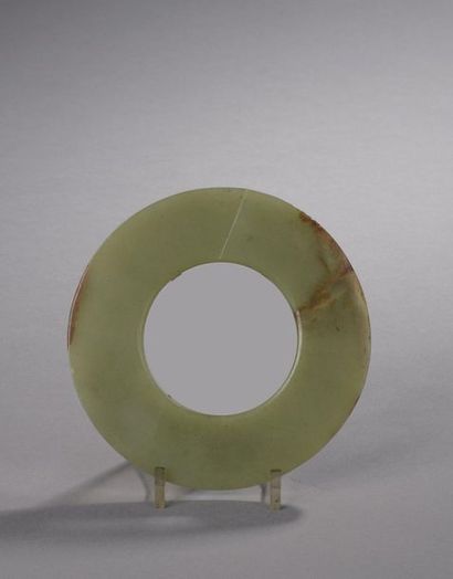 null HUMAN TYPE DISC made of celadon jade-nephrite with rust veins. 

China, in the...