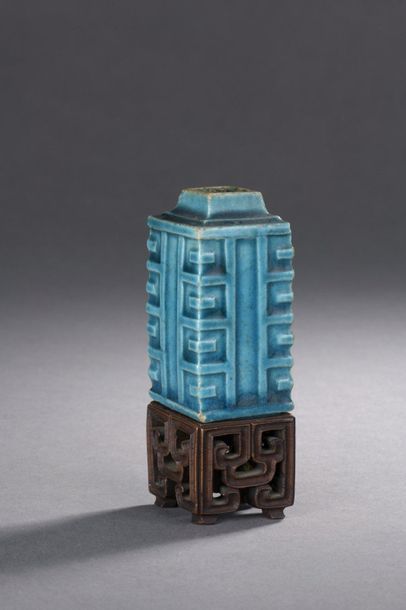 null MINIATURE VASE in the shape of a cong tube in turquoise blue enamelled stoneware....