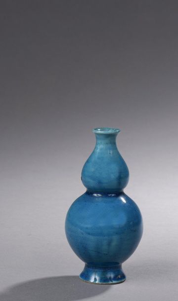 null MINIATURE VASE in the shape of a double gourd in turquoise blue enamelled porcelain.

China,...