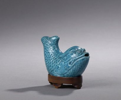 null DROP COUNTER in turquoise blue enamelled stoneware in the shape of a fish. Wooden...