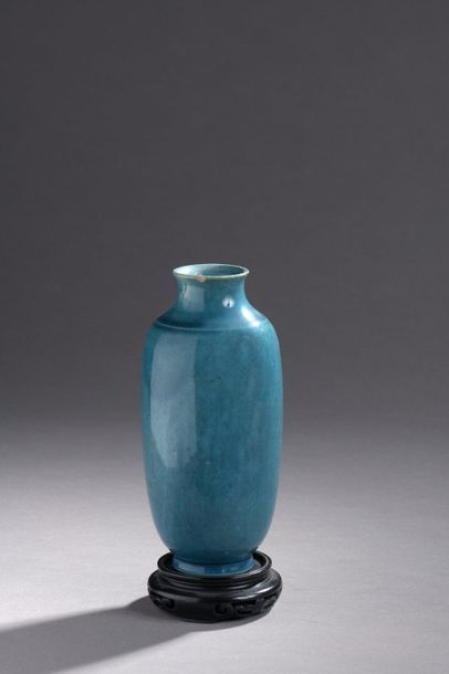 null VASE of baluster shape in blue turquoise enamelled porcelain. Grainy at the...