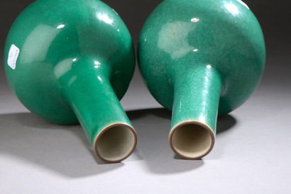 null TWO porcelain bottle-shaped VASES with green monochrome cover.

China, Qing...
