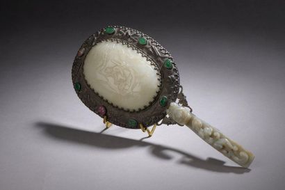 null MIRROR of the face to hand type composed of a handle formed by a celadon jade-nephrite...