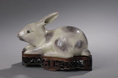 null SUBJECT in beige and brown glazed stoneware, depicting a lying rabbit. Openwork...