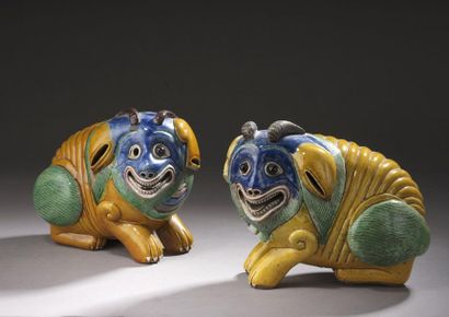 null Pair of yellow, green, blue and manganese glazed stoneware SUBJECTS, representing...