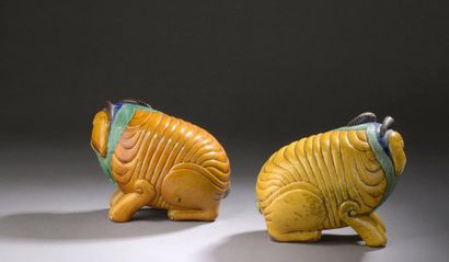 null Pair of yellow, green, blue and manganese glazed stoneware SUBJECTS, representing...
