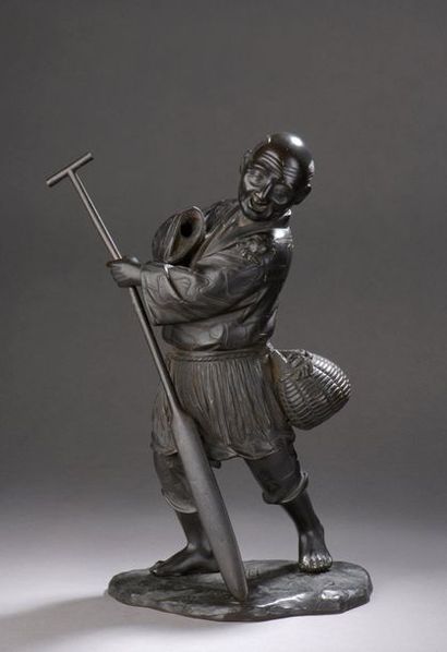 null Bronze OKIMONO depicting a standing fisherman, his outfit decorated with birds...