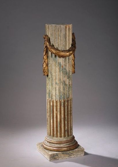 null Rudent fluted column-shaped wooden saddle decorated with a garland of laurel....