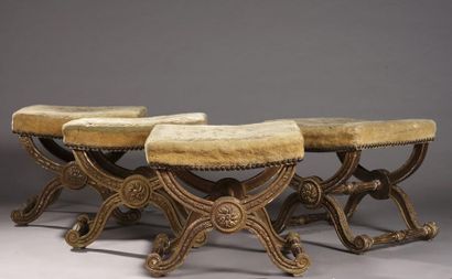 null SUITE OF FOUR rectangular TABOURETS with carved and gilded beech X-shaped legs...