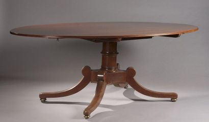 null EATING ROOM TABLE in mahogany and mahogany veneer with tilting oval top. Corrugated...