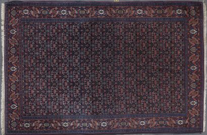null FERAHAN RUG with herati decoration on a midnight blue background. Border of...