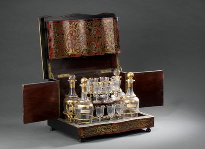 null LIQUEUR CELLAR with brass marquetry decoration on a red tortoiseshell background....